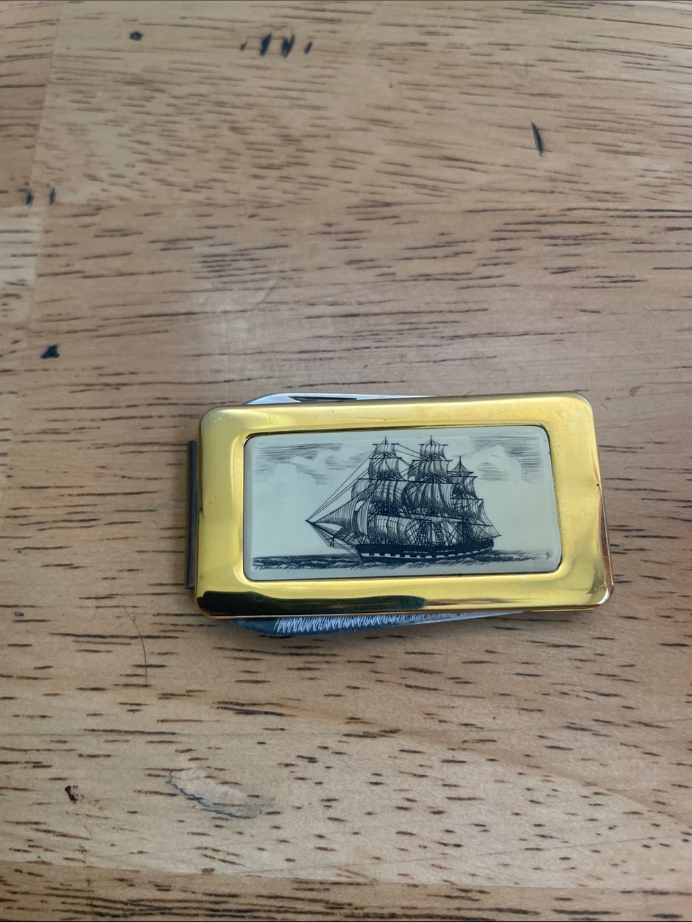 Gold-Tone Ship Engraved Money Clip with knife and file.